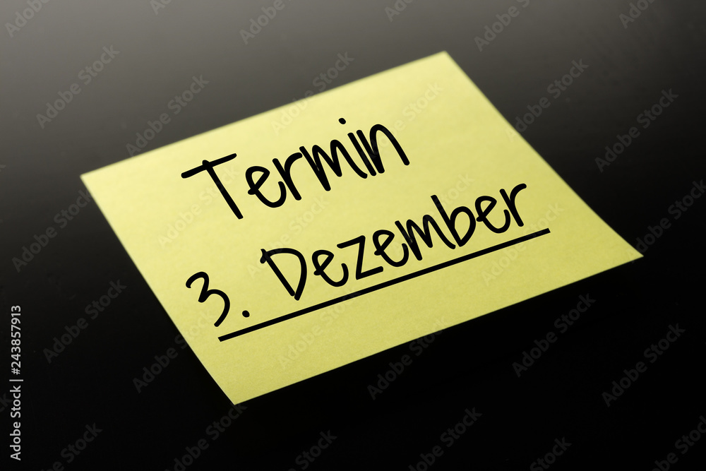 Termin 3. Dezember - gelber Notizzettel dunkler Hintergrund Termin 3. Dezember - gelber Notizzettel dunkler Hintergrund