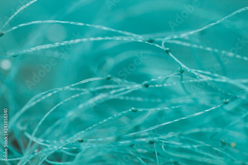 Macro photograph of green fishing net