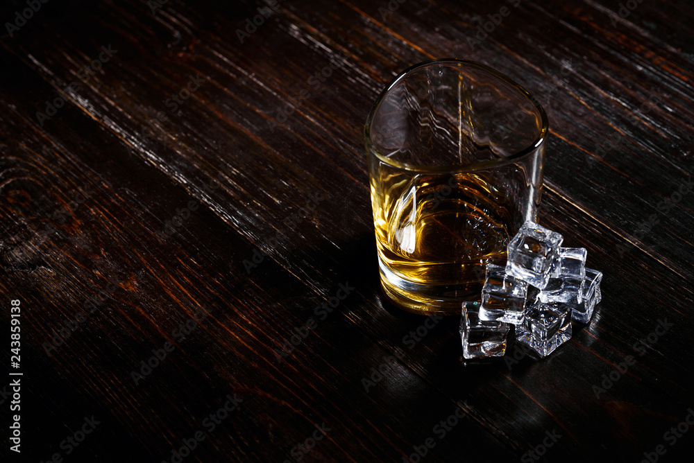 whiskey with ice in modern glasses whiskey with ice in modern glasses