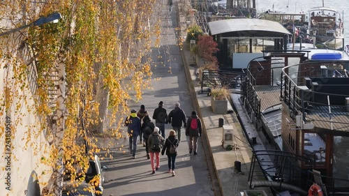 Wallpaper Mural Paris France people group walking the Seine river embankment Torontodigital.ca