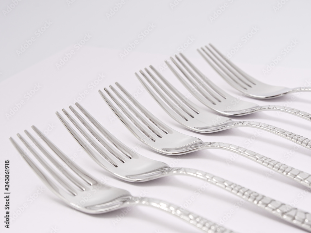 silverware forks spoons knives cutlery on a white background