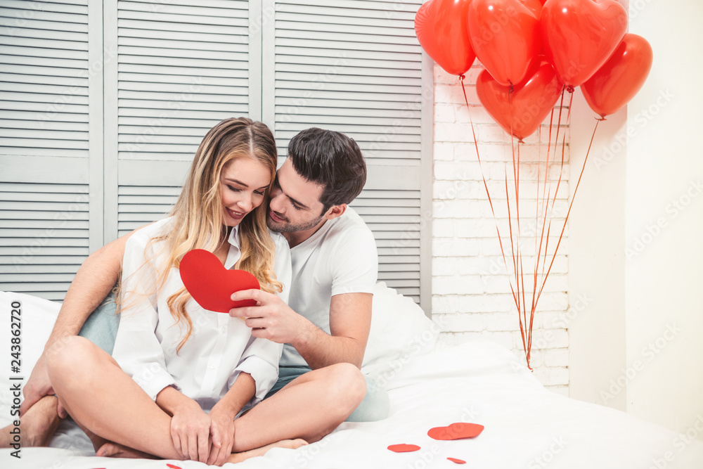 man with girlfriend reading gift card man with girlfriend reading gift card