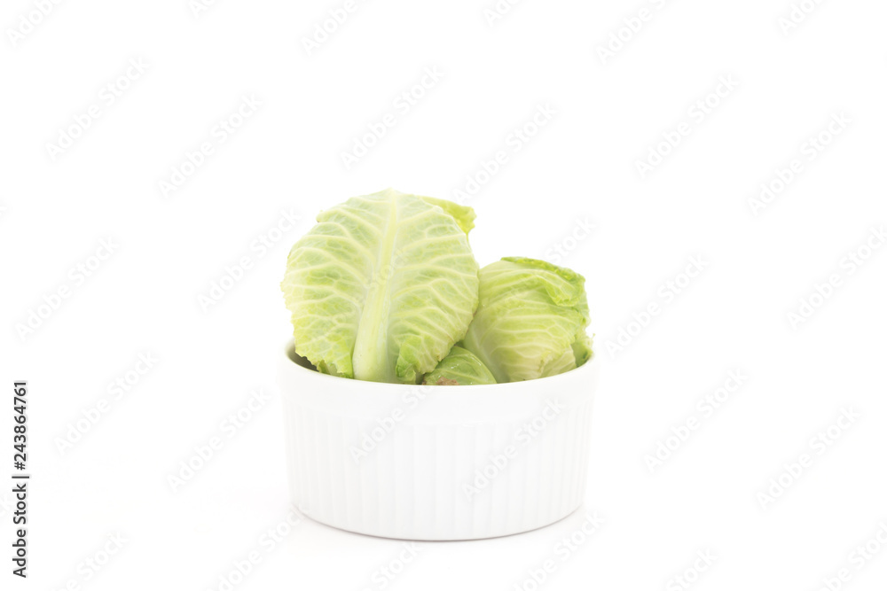 Small green cabbage isolated on white background Small green cabbage isolated on white background