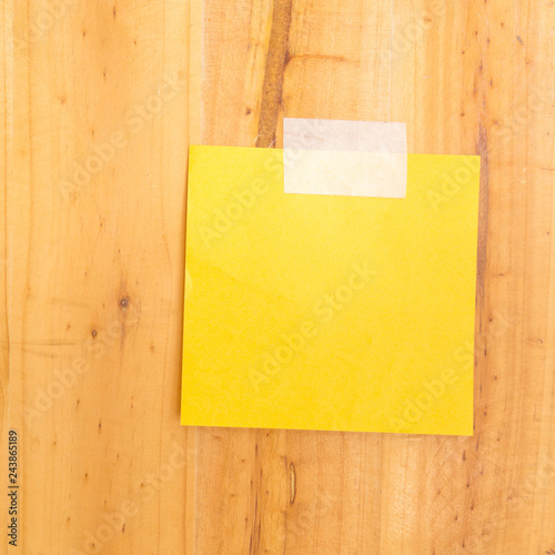 Blank notepaper on wooden background.