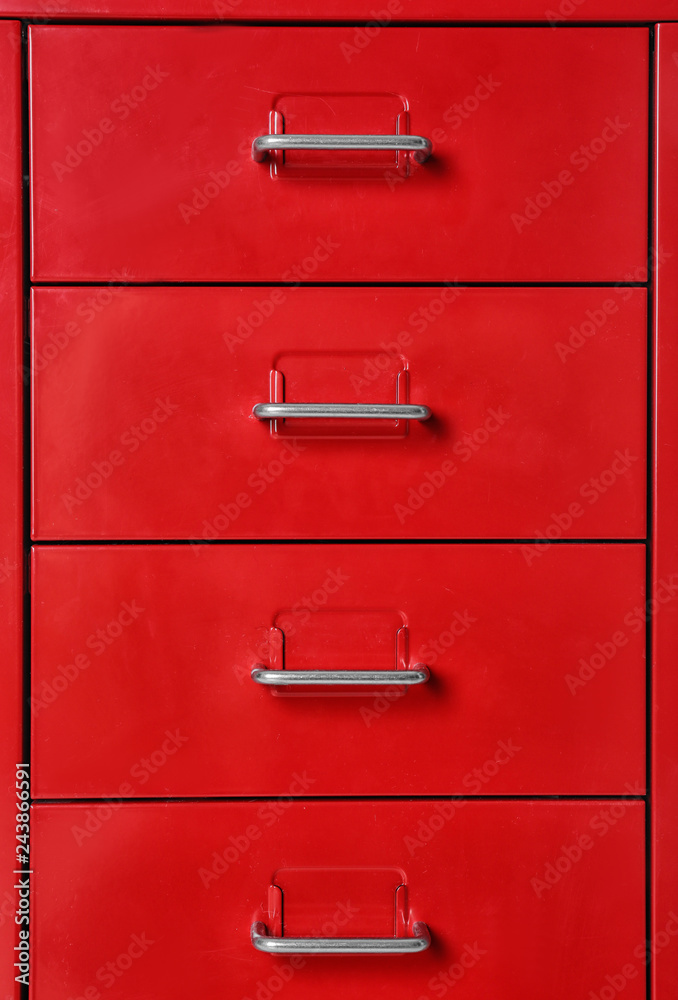 Red wardrobe drawers as background, closeup view Red wardrobe drawers as background, closeup view