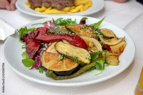 Fresh grilled vegetables on white plate, tasty and healthy lunch