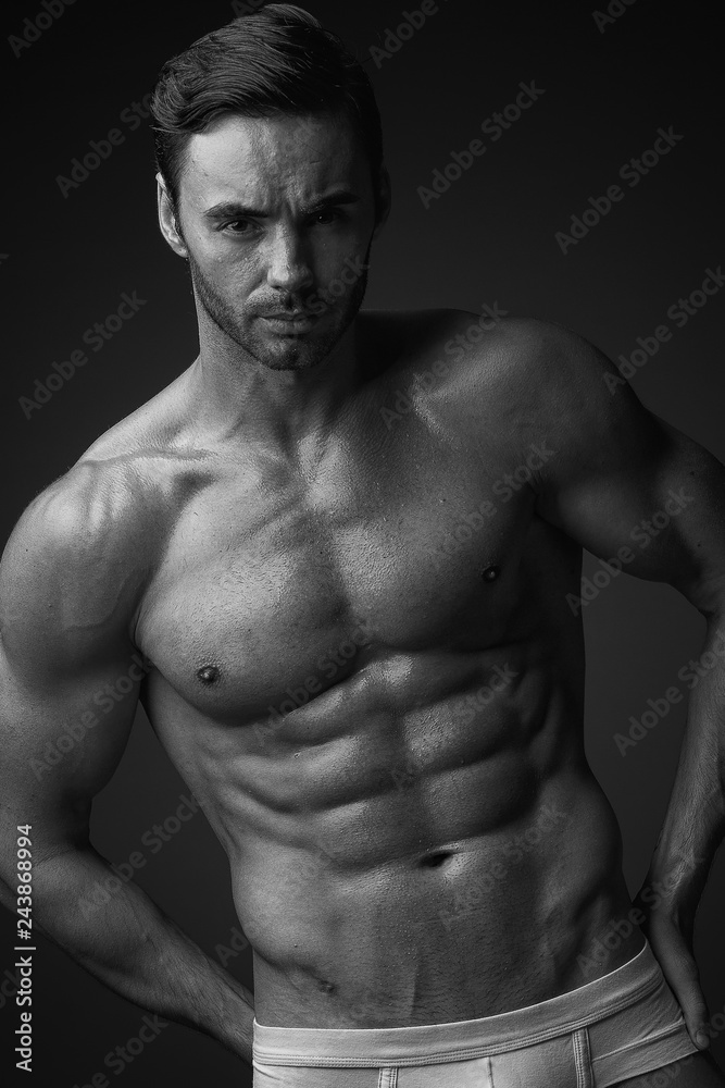 Fototapeta premium Young athletic male in underwear posing on camera.