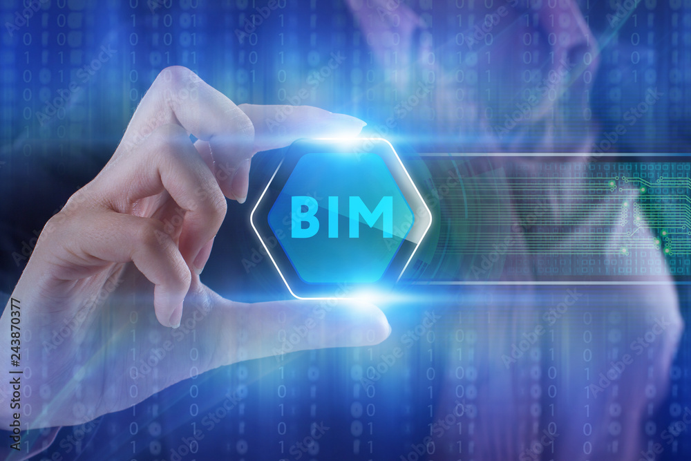 The concept of business, technology, the Internet and the network. A young entrepreneur working on a virtual screen of the future and sees the inscription: BIM The concept of business, technology, the Internet and the network. A young entrepreneur working on a virtual screen of the future and sees the inscription: BIM