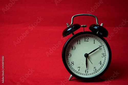 Clock ticking to 6 o'clock on the red background