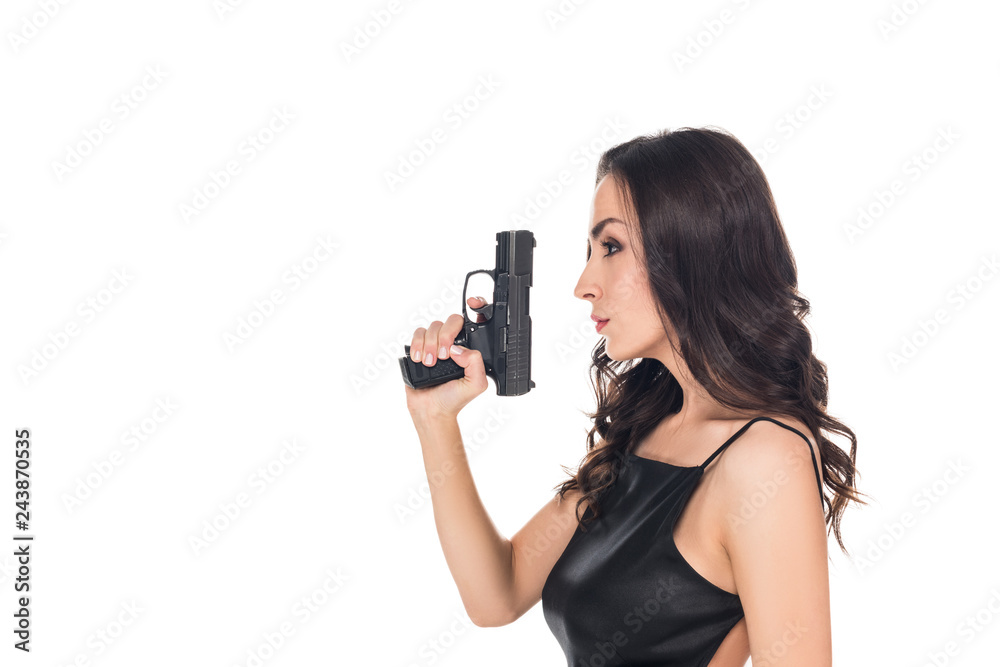 beautiful secret agent in black dress holding handgun, isolated on white beautiful secret agent in black dress holding handgun, isolated on white
