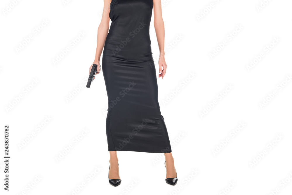 cropped view of female killer in black dress holding gun, isolated on white cropped view of female killer in black dress holding gun, isolated on white
