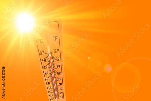 ilustracja pomarańczowego i żółtego koloru przedstawiającego słońce i termometr otoczenia