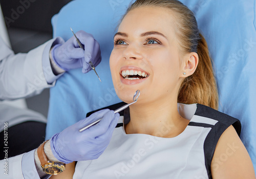 beautiful girl in the dental chair on the examination at the de