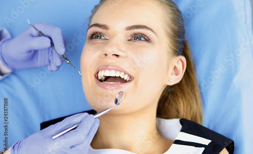 beautiful girl in the dental chair on the examination at the de