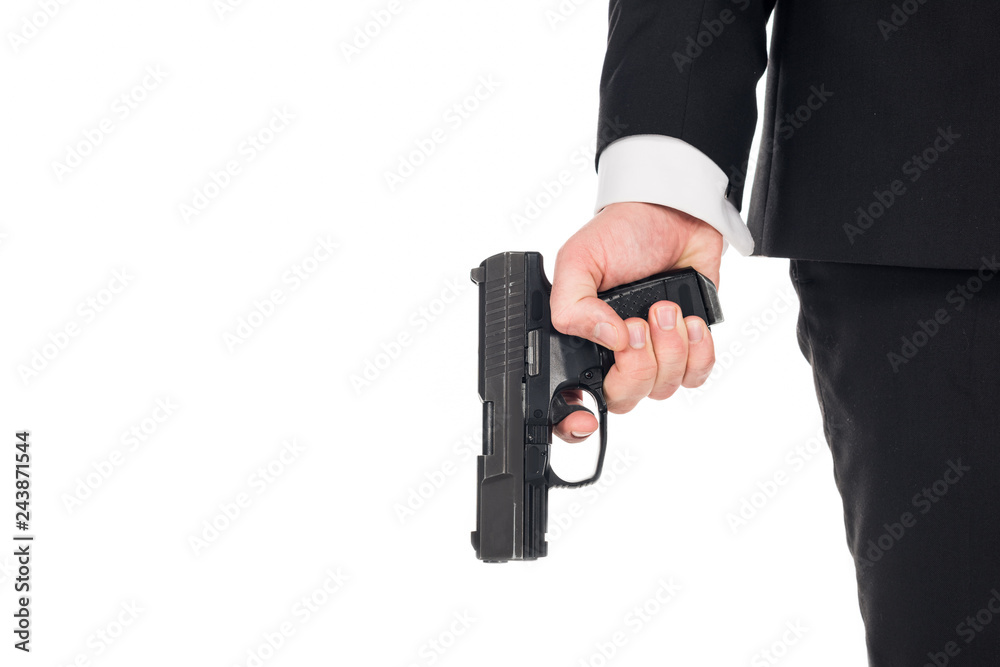 partial view of secret agent holding gun, isolated on white partial view of secret agent holding gun, isolated on white