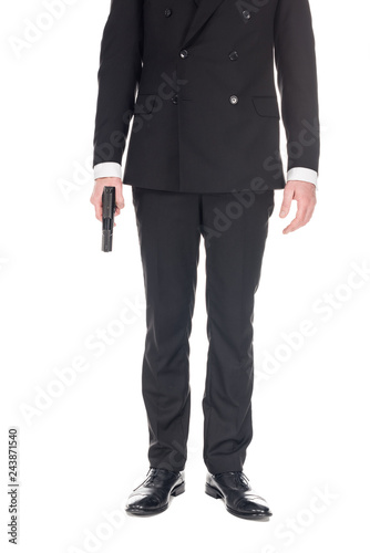 cropped view of killer in black suit holding handgun, isolated on white