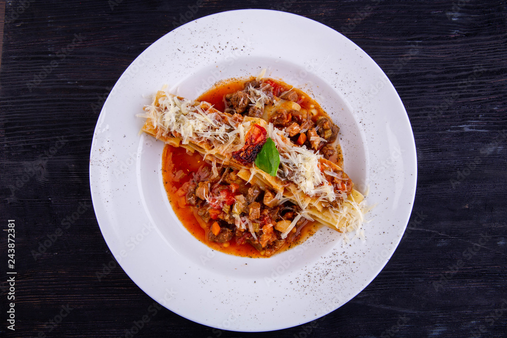 Ragout from a lamb with olives, a sage and tomatoes, pekorino and garlic Ragout from a lamb with olives, a sage and tomatoes, pekorino and garlic