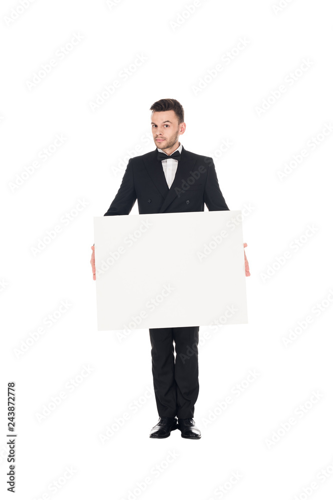 handsome elegant man in black suit posing with blank placard isolated on white handsome elegant man in black suit posing with blank placard isolated on white