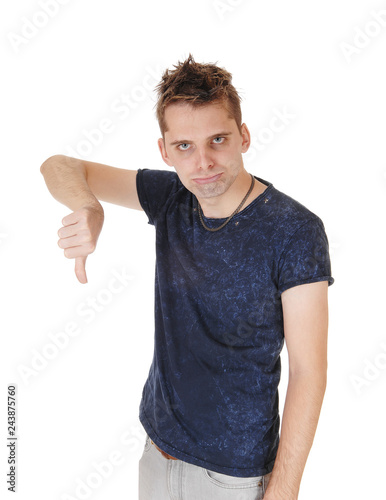 Angry man standing with his thump down photo