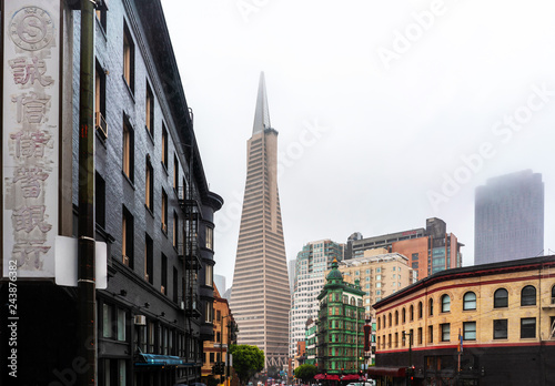San Francisco downtown view with Trans America building and fog over the city.