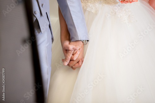 Man and woman holding hands in wedding ceremony . bride and groom holding hand in wedding ceremony.
