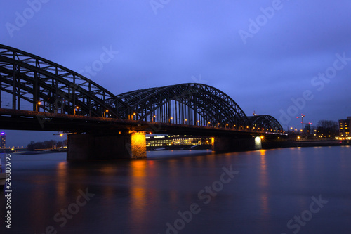 View of the old Hohenzollern Bridge, the Skyline and a bright, Cologne at Night - Germany, Cologne 2019