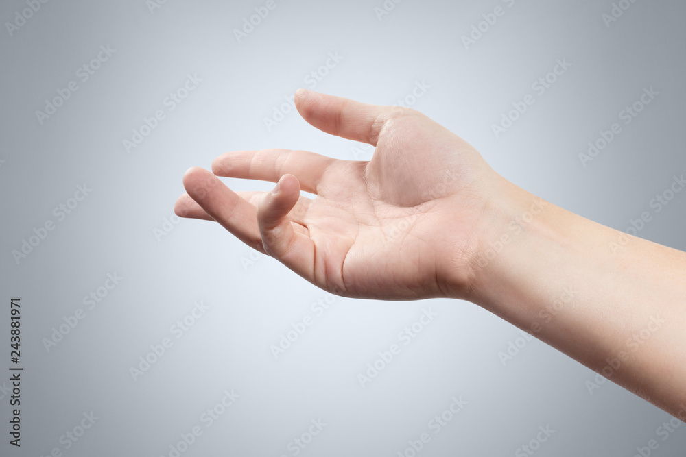 Hand throwing or showing something on gray background Hand throwing or showing something on gray background