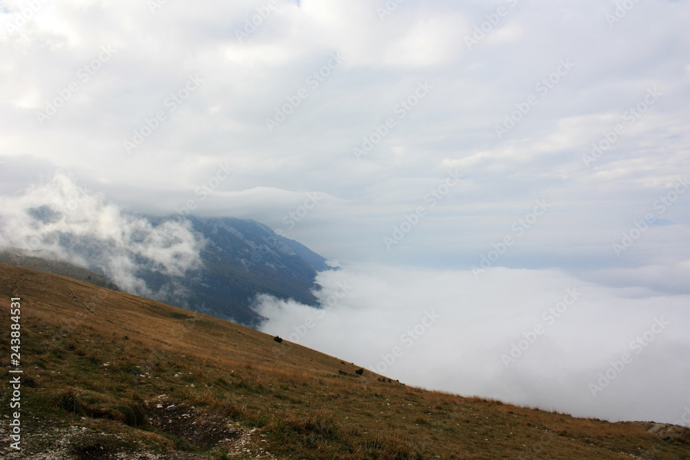 Monte Baldo slope in the clouds, Italy