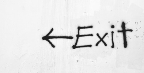 Acrylglasbilder Graffiti painted exit sign on old white wall  © sema_srinouljan