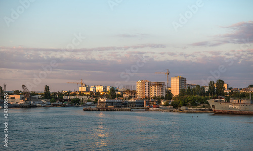 port city at sunset © Irina
