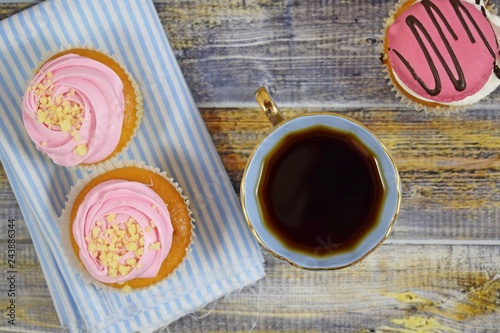 Delicious cakes on wooden background.Sweet dessert for coffee. photo