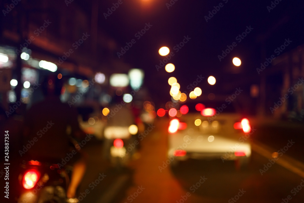 traffic light of driving car on city night street road, abstract blur bokeh background