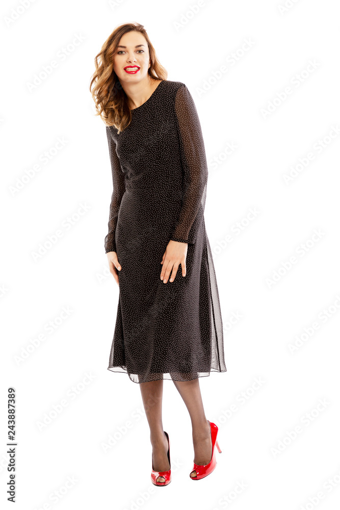 Beautiful laughing young woman in full-length dress, isolated on white background Beautiful laughing young woman in full-length dress, isolated on white background