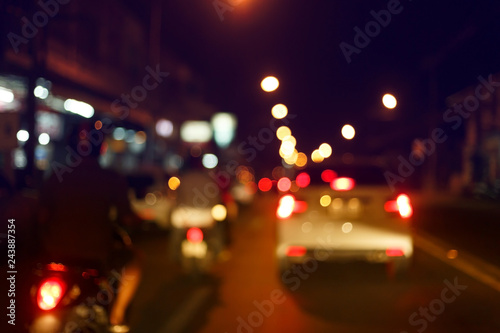 traffic light of driving car on city night street road, abstract blur bokeh background