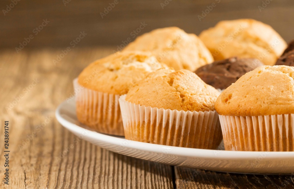Chocolate cake and nut cake, homemade cakes on wooden background