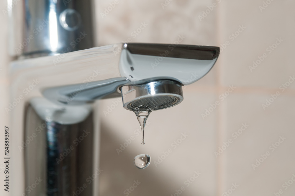 Bath faucet and water drops close up Bath faucet and water drops close up