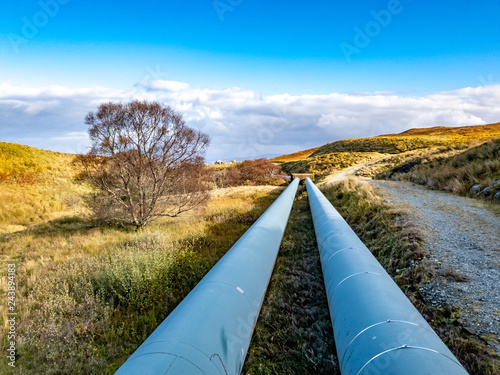 Pipeline of the Storr Lochs hydroelectric power station nestled under the mountains of the Trotternish Peninsula on the Isle of Skye in the West Highlands of Scotland