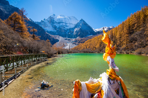 pearl lake with snow mountain  in yading nature reserve, Sichuan, China. photo