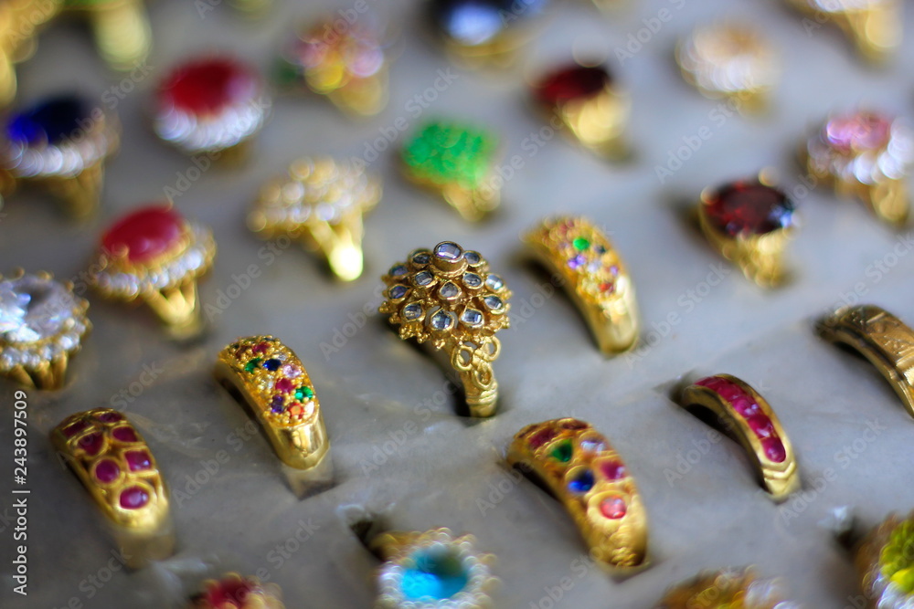 A gemstone ring is a beautiful jewelry on a black cloth. A gemstone ring is a beautiful jewelry on a black cloth.