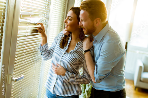 Young couple by the window