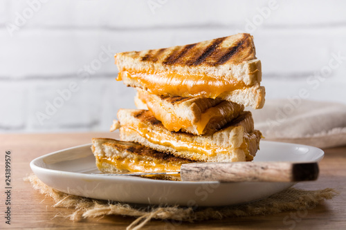 Grilled cheese sandwich on wooden table

