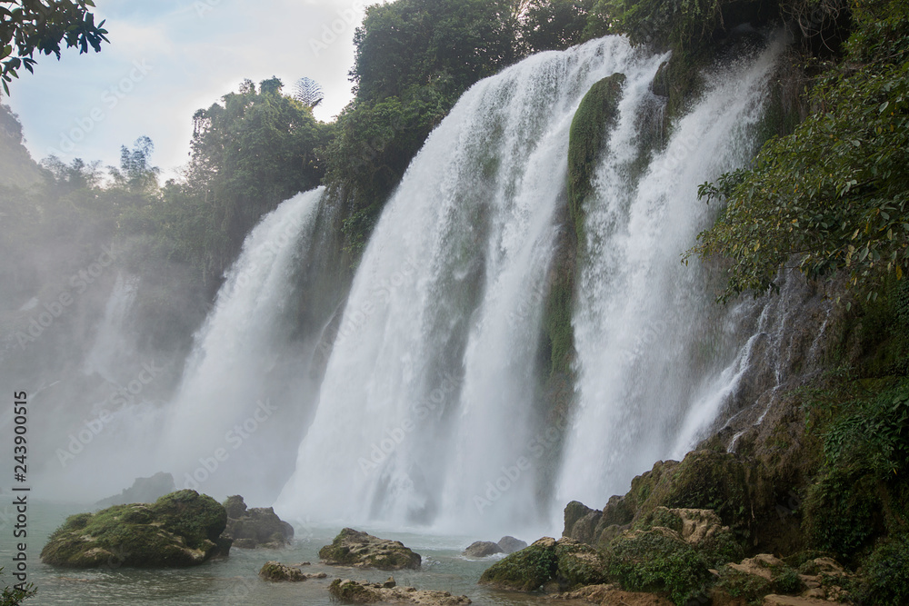 Fototapeta premium View of the falls from Vietnam during the rainy season when the flow is at its maximum Ban Gioc -Detian Falls is a collective name for two waterfalls on the Quay Son River