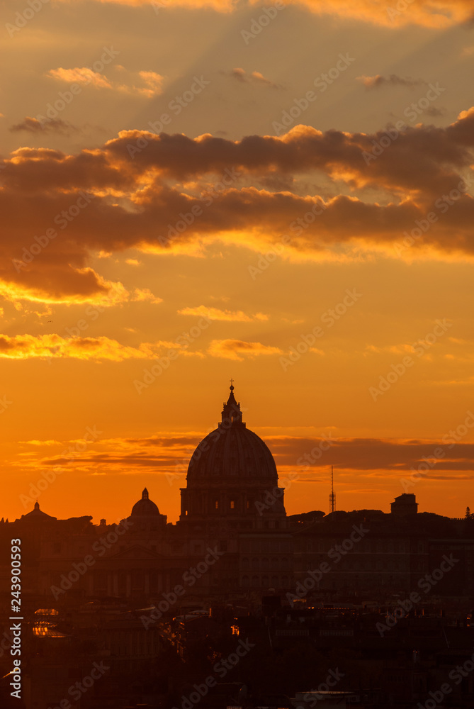 View of Rome historic center sunset skyline with ancient St Peter dome