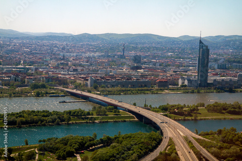 Architectural landscape aerial birds eye view of city skyline and roads with landscape and river Danube in clear blue sky background in Vienna Austria