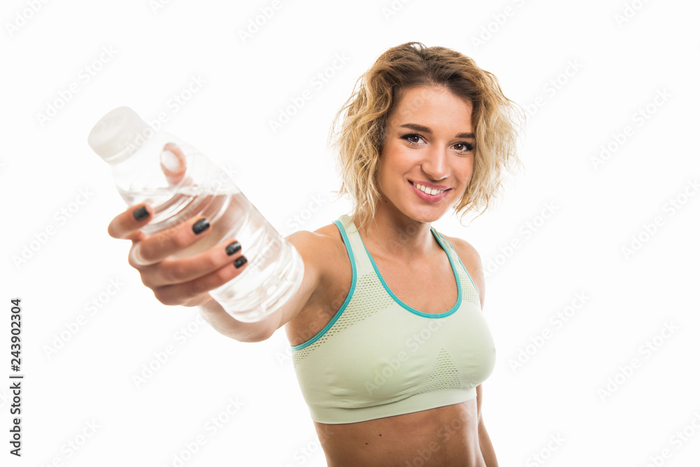 Portrait of beautiful young fit girl offering bottle of water Portrait of beautiful young fit girl offering bottle of water