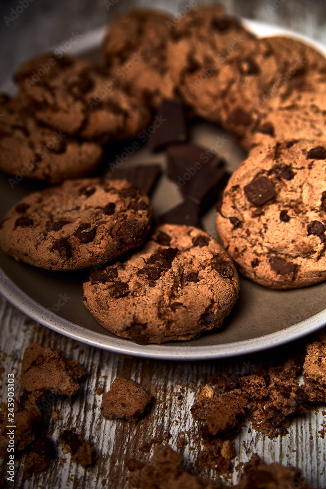 group of tasty cookies next to a bowl on an old wooden board
group of tasty cookies next to a bowl on an old wooden board