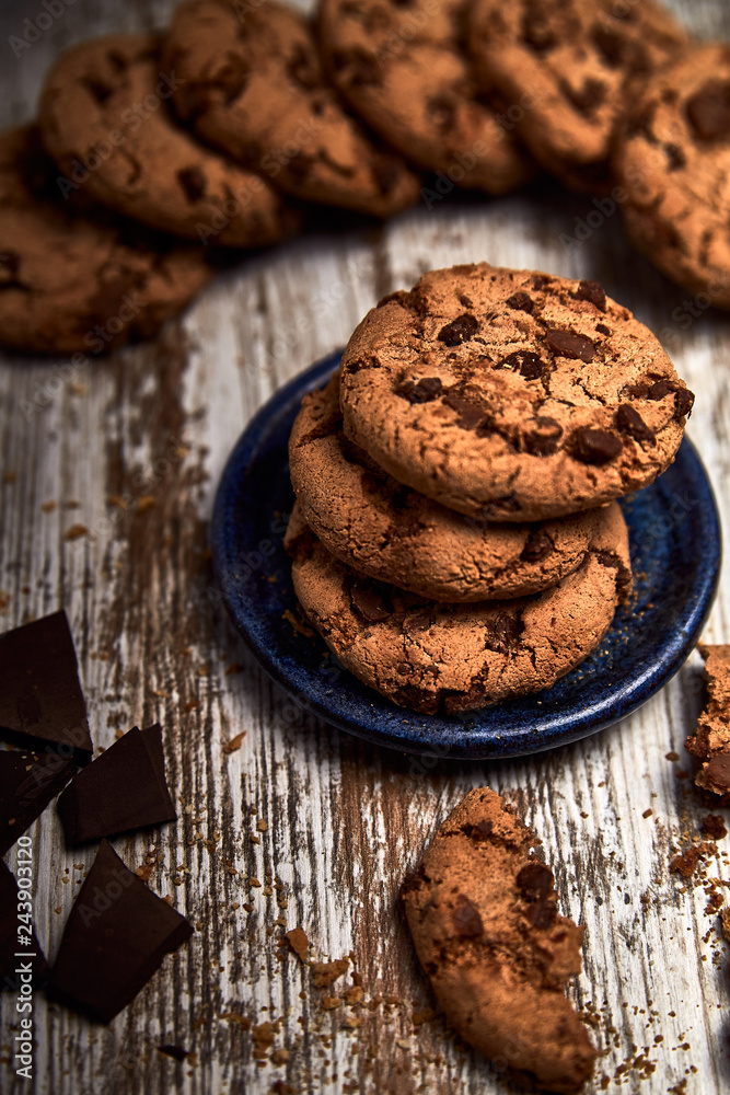 group of tasty cookies next to a bowl on an old wooden board
group of tasty cookies next to a bowl on an old wooden board