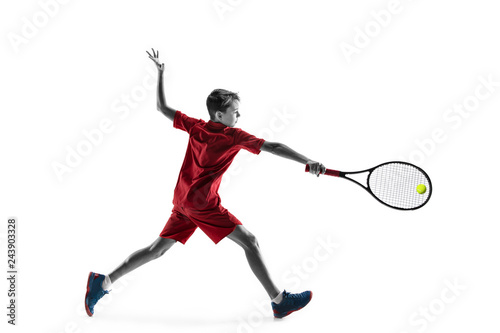 Young teen boy tennis player in motion or movement isolated on white studio background. The sport, exercise, training concept © master1305