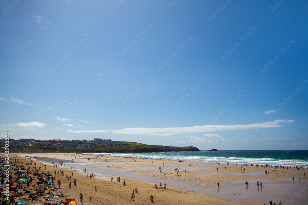 Fistral Beach in Newquay in England UK over a bright blue background