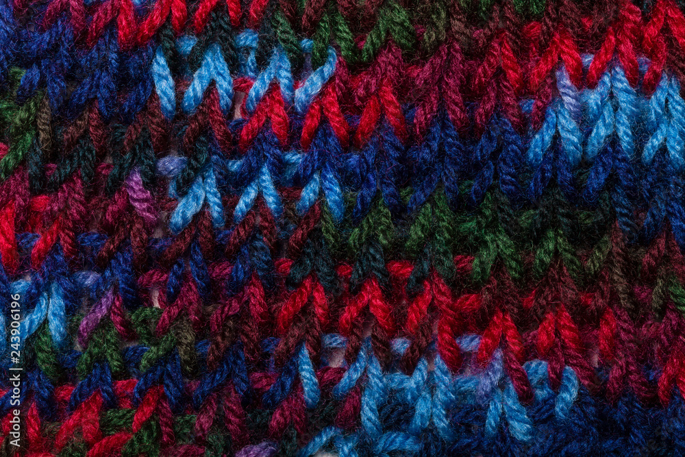 Close up of knotting stitches in blue, red and green colors